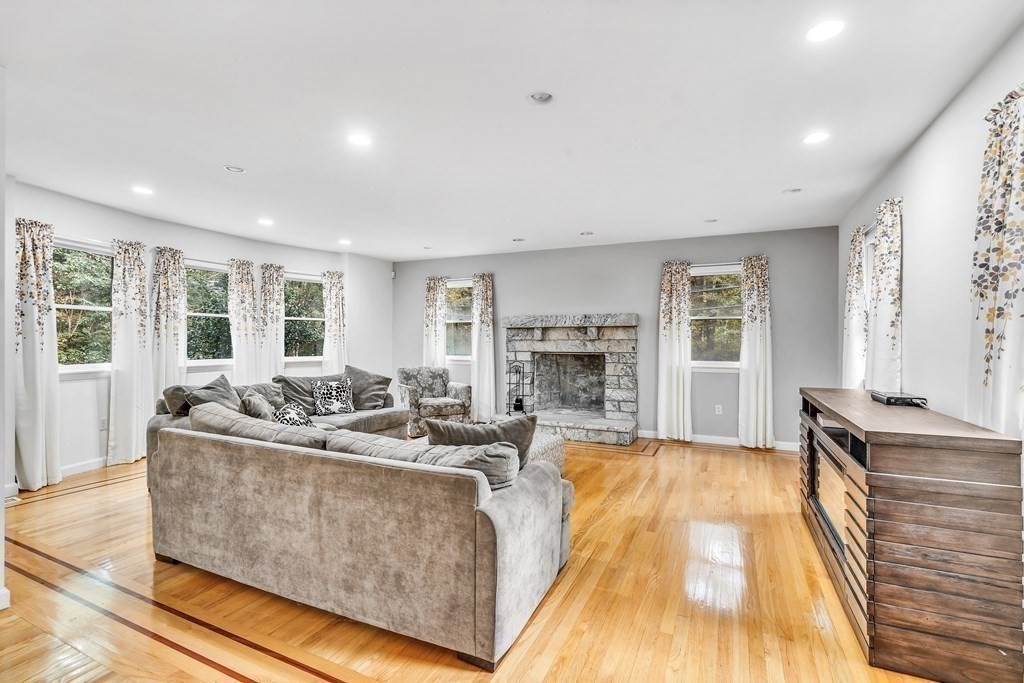 3 Goodnow Road Sudbury, MA 01776 - Photo 10 of 34 a living room with furniture and a fireplace