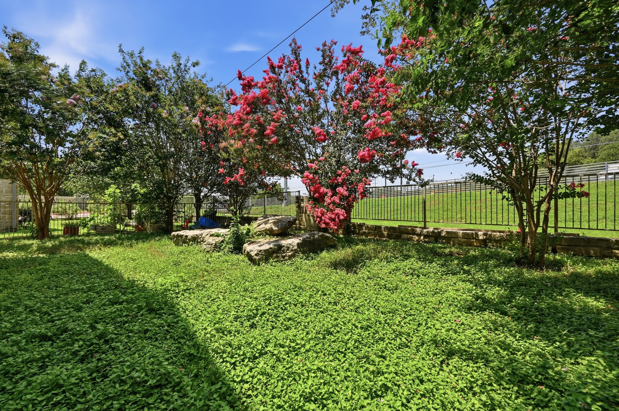 592 Farm To Market 967, Unit B Buda, TX 78610 - Photo 26 of 26 Thoughtfully landscaped and easy to maintain, this private outdoor space offers the perfect setting for relaxing evenings, weekend gatherings, or simply enjoying the fresh air.