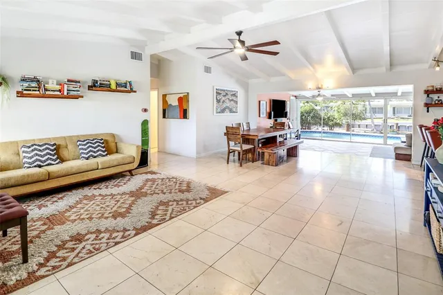 a living room with couches and view of living room