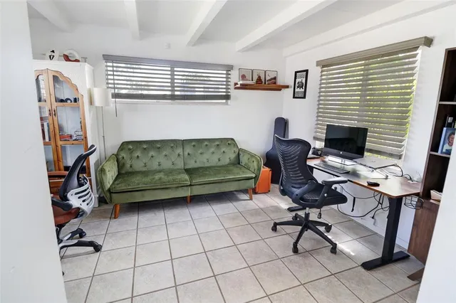 a white refrigerator freezer and a stove sitting inside of a kitchen