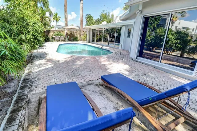 a view of swimming pool with seating space