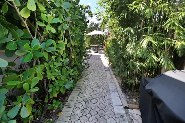 an aerial view of a residential houses with outdoor space