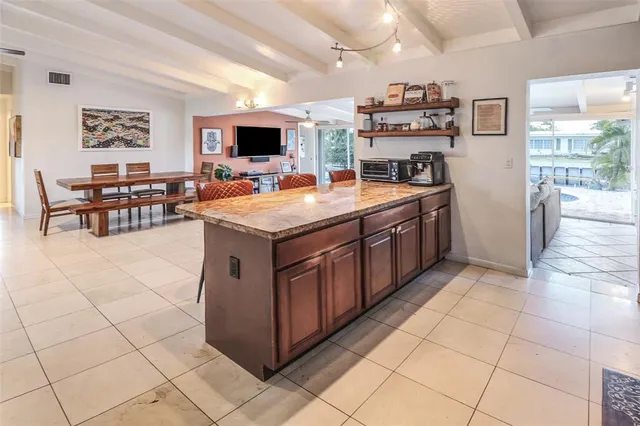 a kitchen with stainless steel appliances a sink and a refrigerator