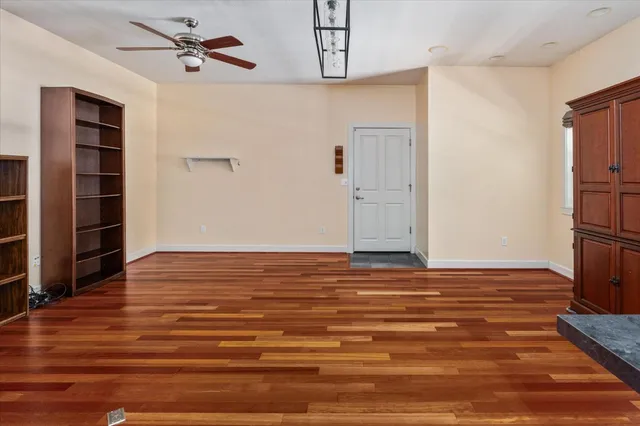 a view of a room with wooden floor and closet