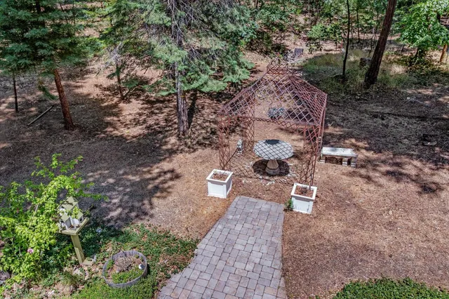 an aerial view of a house with outdoor space