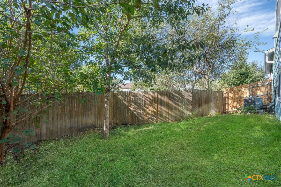 8922 Manchaca Road, Unit 906 Austin, TX 78748 - Photo 13 of 16 a backyard of a house with lots of green space