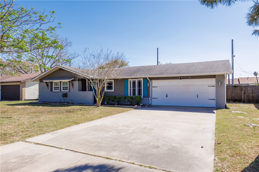 a front view of a house with yard