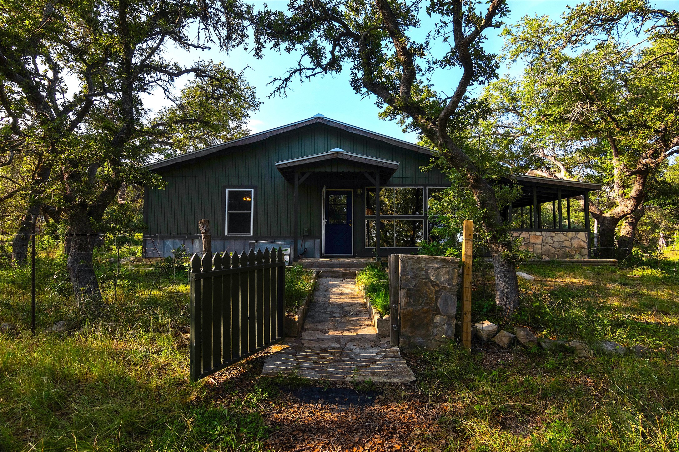 435 Spangenberg Road Blanco, TX 78606 - Photo 37 of 38 a front view of a house with a yard