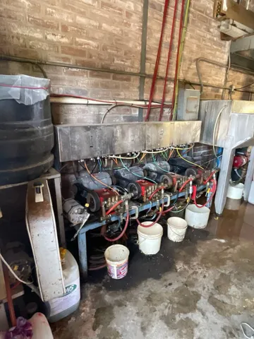 a view of a storage room with water heater and racks