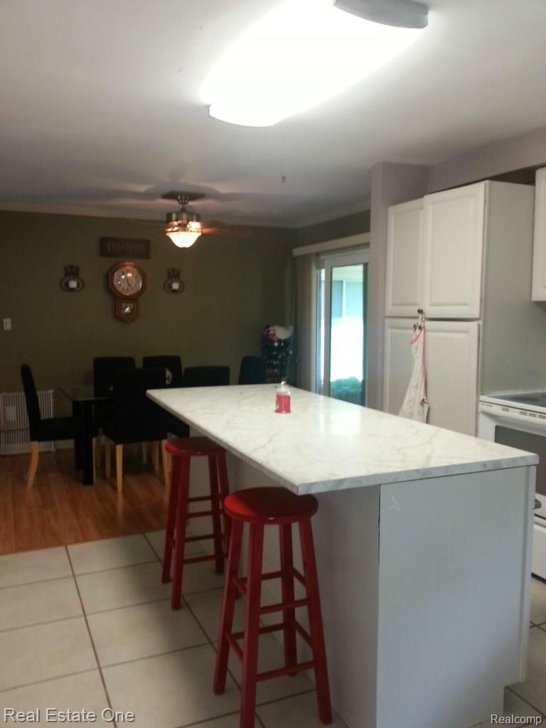 Center Island in Kitchen with barstools for in kitchen eating