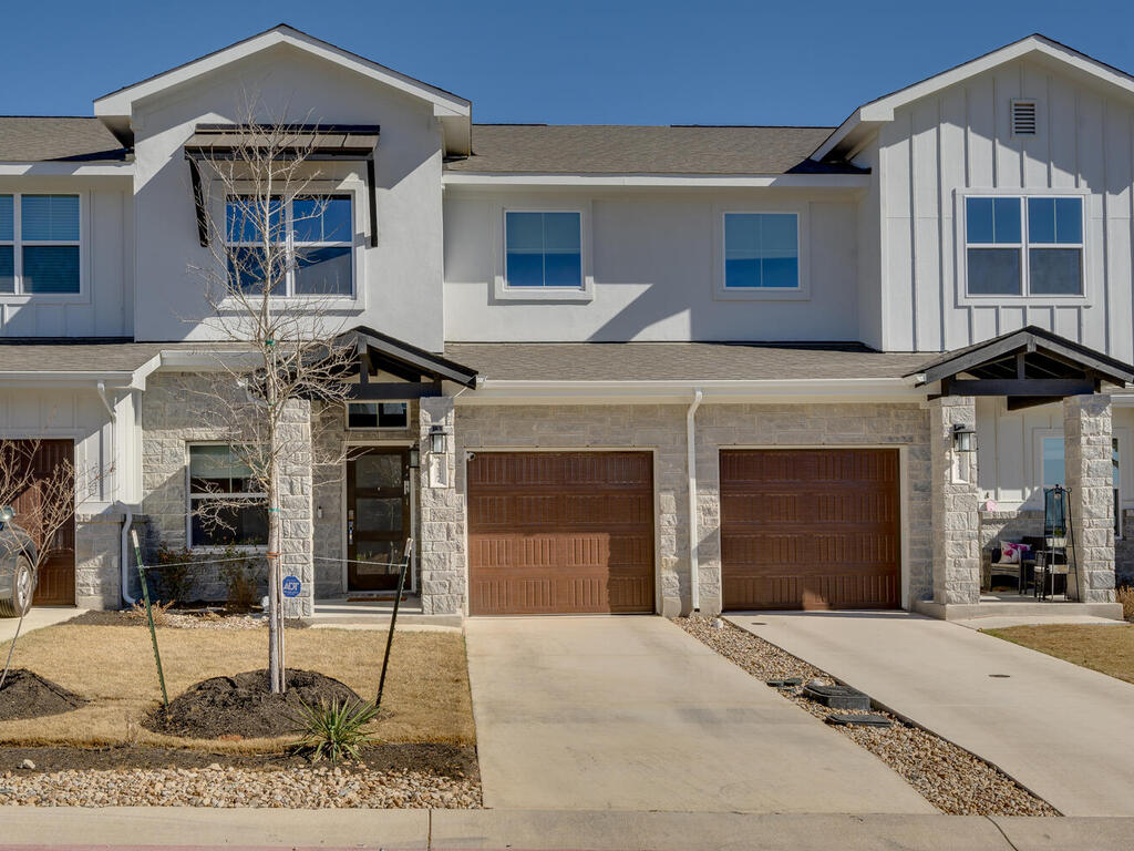 2257 Local Rebel Loop Leander, TX 78641 - Photo 2 of 26 a front view of a house with entertaining space