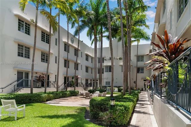 a swimming pool with outdoor seating and yard