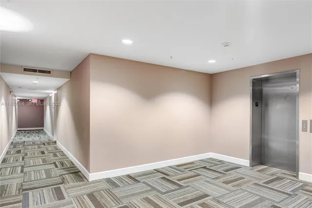 a living room with furniture a flat screen tv and a large window