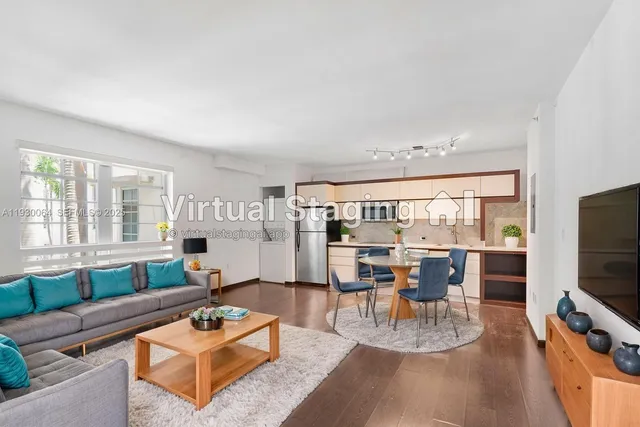 a kitchen with a refrigerator and a stove top oven