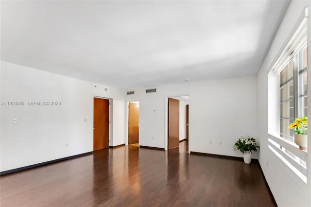 a kitchen with stainless steel appliances granite countertop a sink and a refrigerator