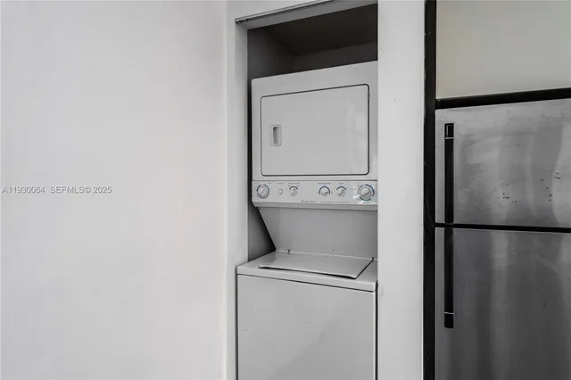 a bathroom with a sink mirror and toilet