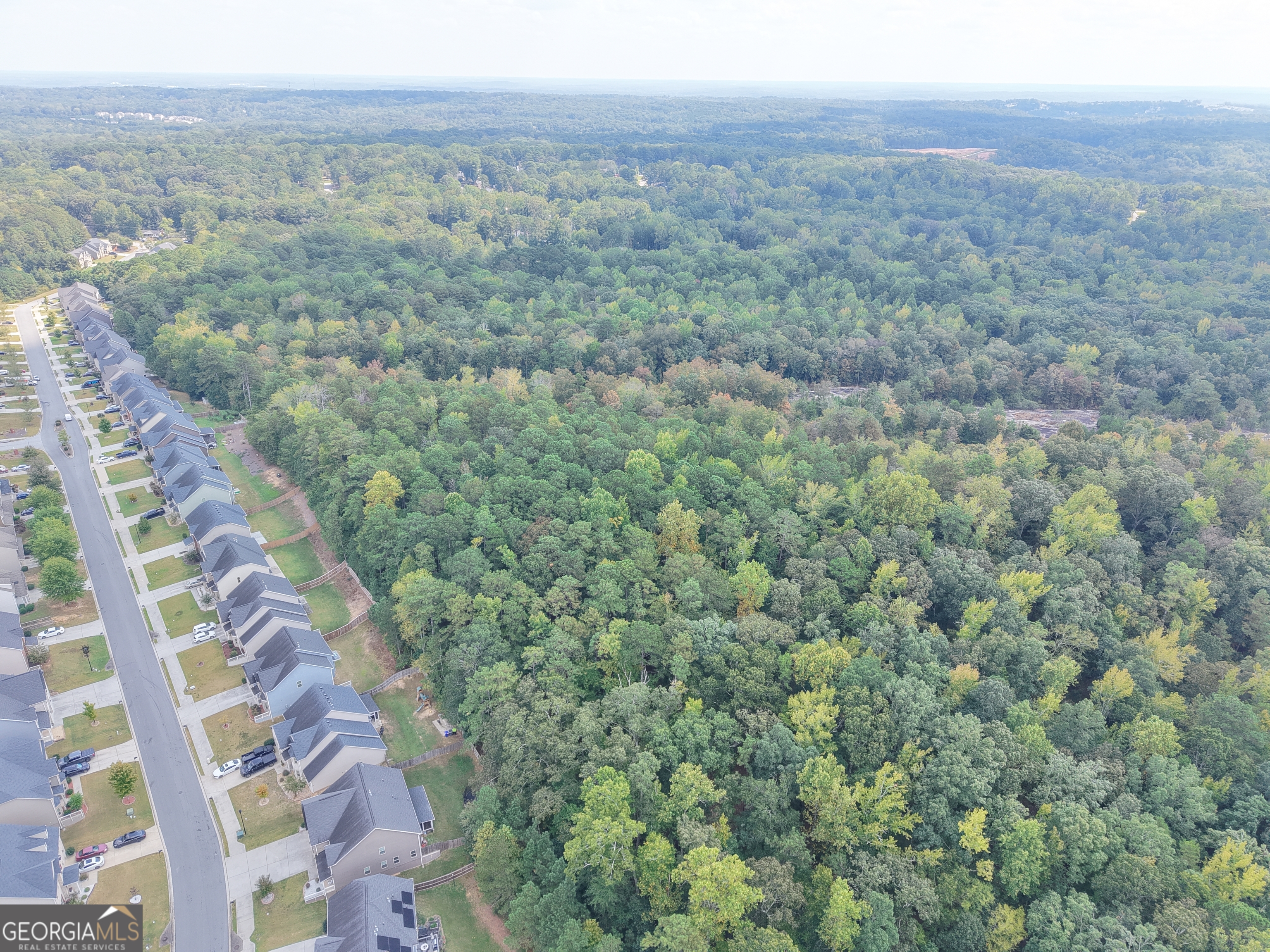 a view of a field with an ocean