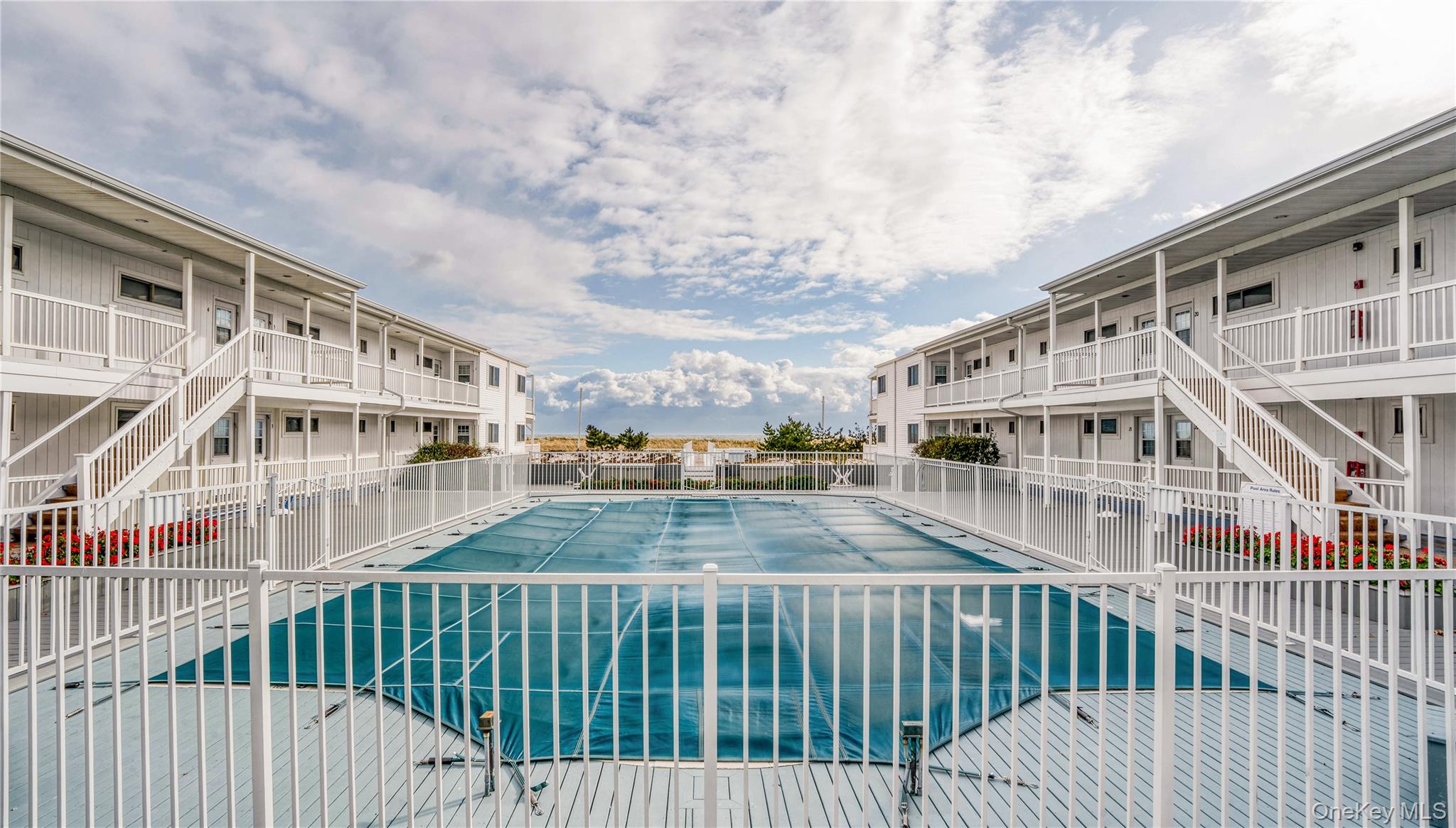 281 Dune Road, Unit 2A Westhampton Beach, NY 11978 - Photo 11 of 19 a view of building from balcony