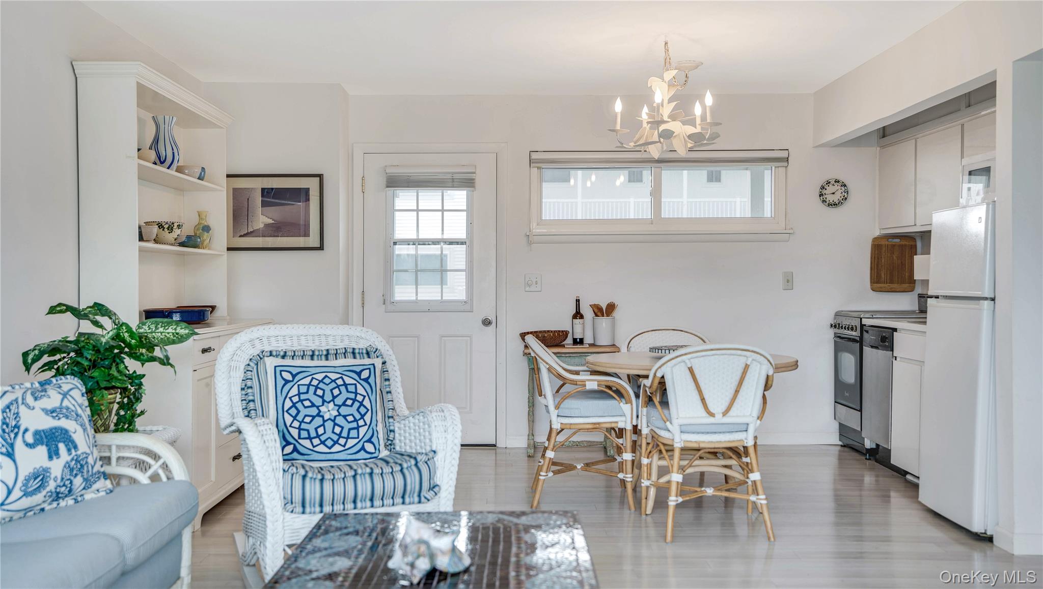 281 Dune Road, Unit 2A Westhampton Beach, NY 11978 - Photo 13 of 19 a view of a livingroom with furniture window and wooden floor