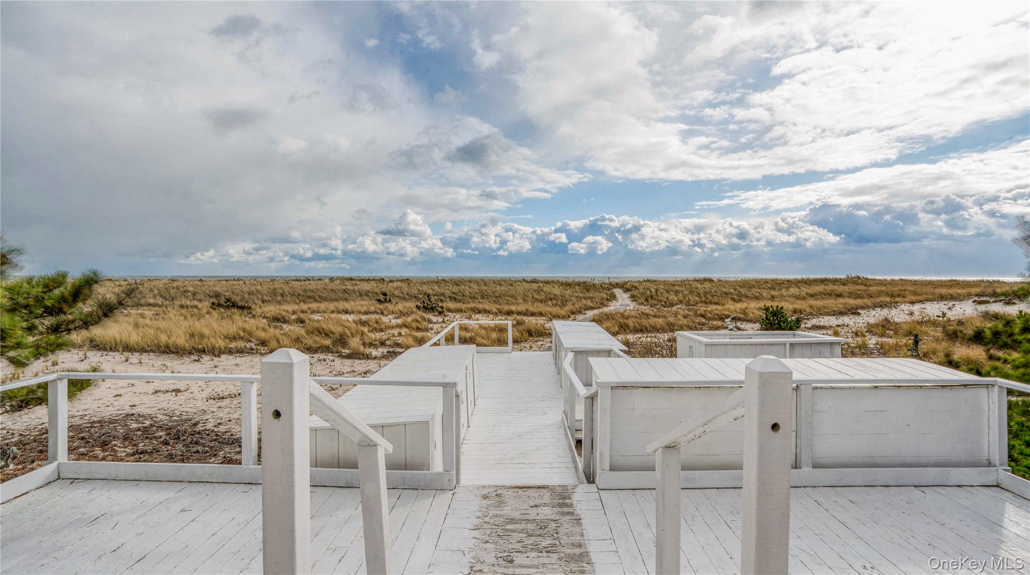 281 Dune Road, Unit 2A Westhampton Beach, NY 11978 - Photo 18 of 19 a view of a terrace with wooden floor and city view
