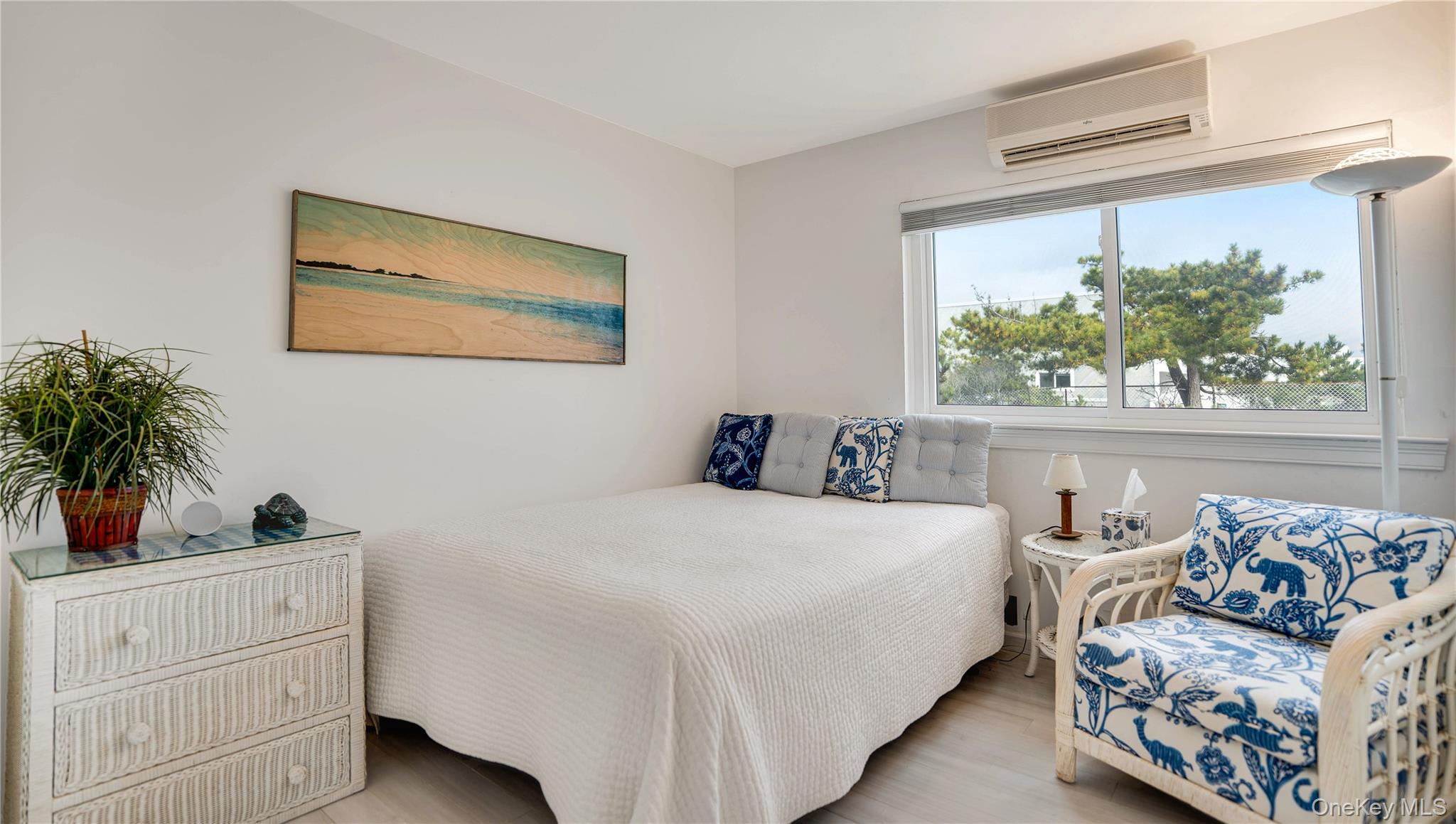 281 Dune Road, Unit 2A Westhampton Beach, NY 11978 - Photo 7 of 19 a bedroom with bed and a window