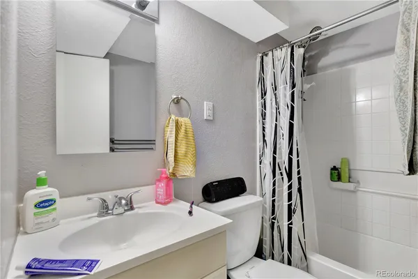 a kitchen with a sink and refrigerator
