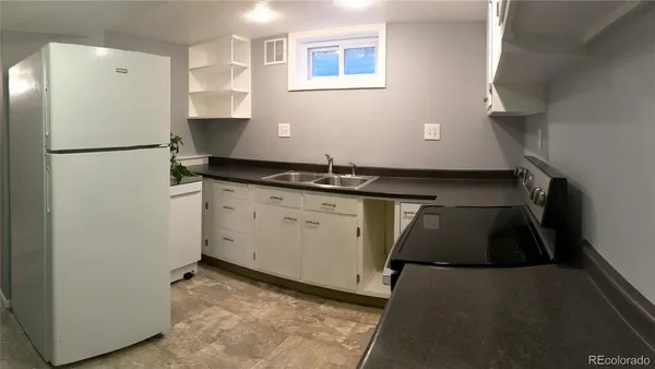 a view of a workspace with furniture and a couch