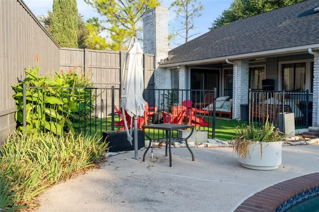 a view of a chairs and table in the patio