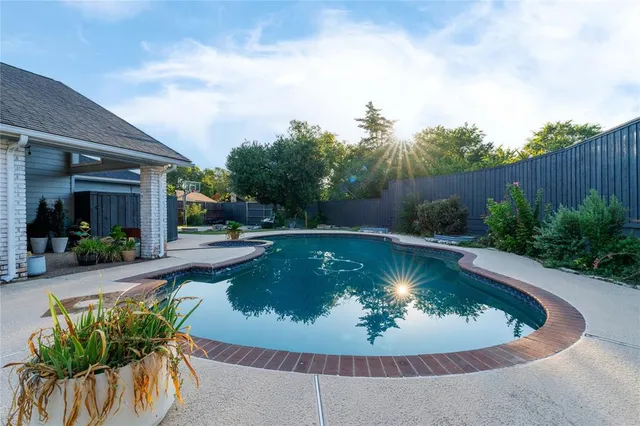 a view of a swimming pool with a sitting space