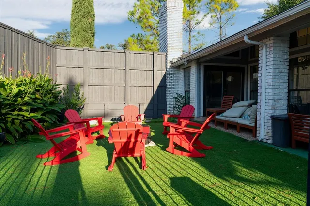a backyard of a house with seating space