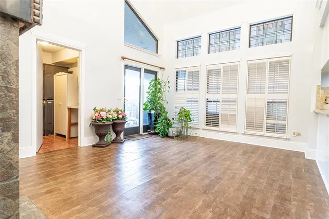 a view of a living room and a window in the living room