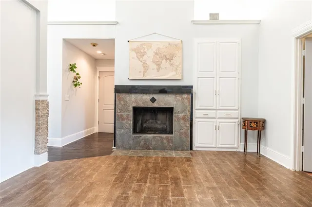 a view of empty room with furniture and a fireplace