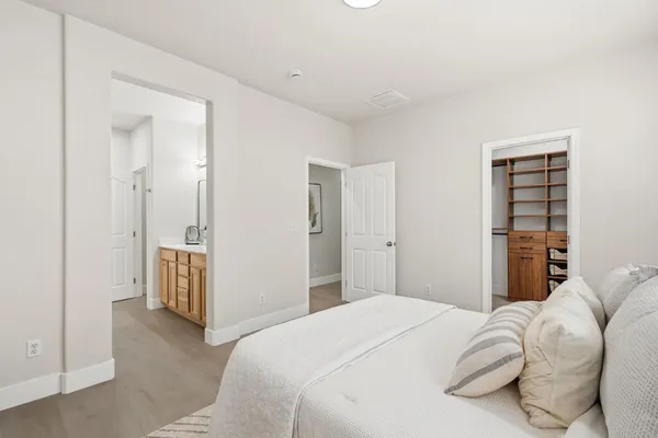 a bedroom with a bed and closet