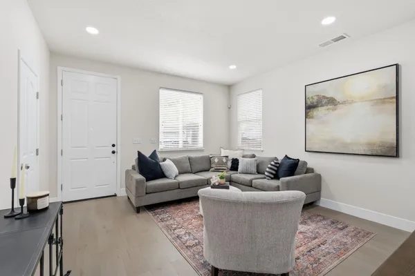a living room with furniture and a window