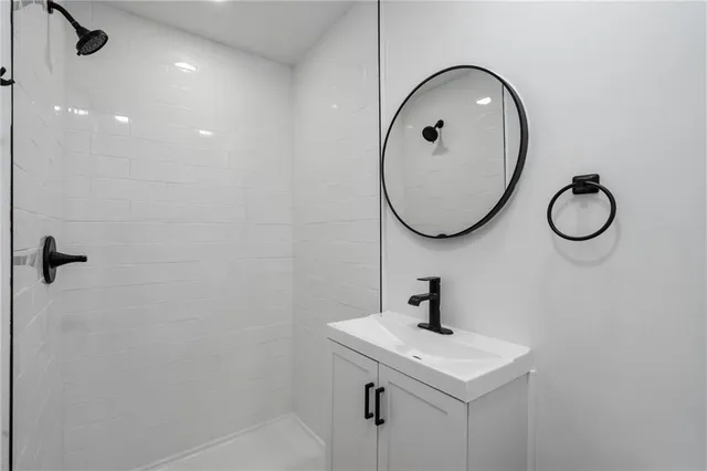 a bathroom with a sink and mirror