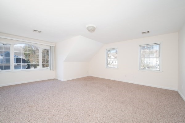 117 Tamarack Lane, Unit 117 Abington, MA 02351 - Photo 14 of 26 an empty room with windows