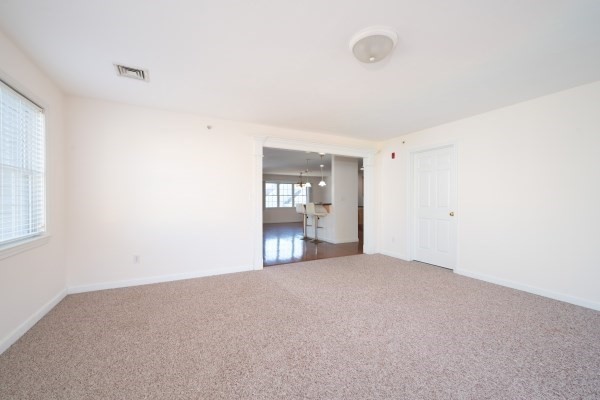 117 Tamarack Lane, Unit 117 Abington, MA 02351 - Photo 15 of 26 a view of empty room with wooden floor