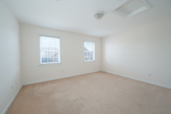 117 Tamarack Lane, Unit 117 Abington, MA 02351 - Photo 21 of 26 an empty room with windows