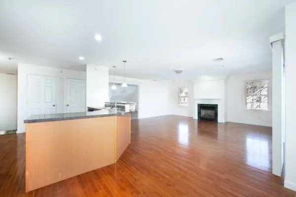 a view of kitchen with furniture and wooden floor
