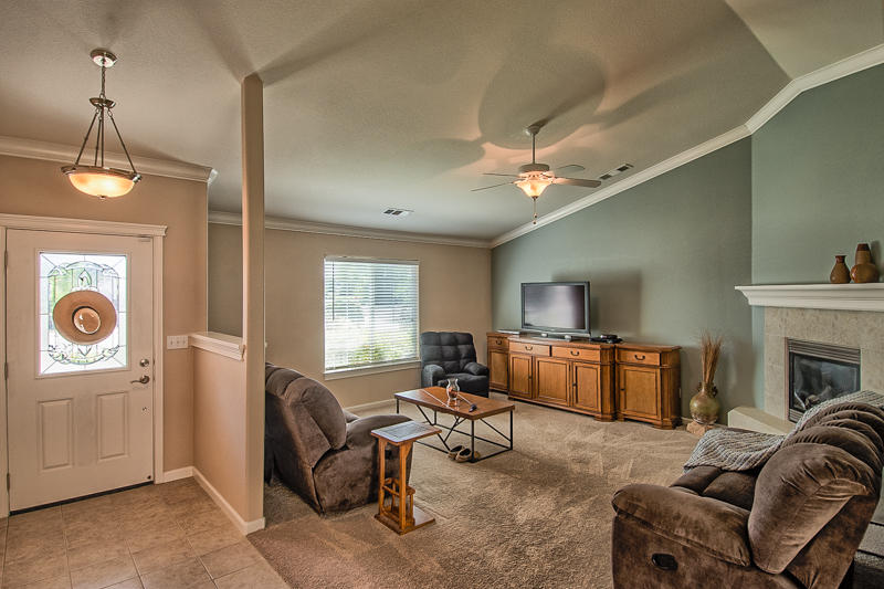 7450 Pit Road Redding, CA 96001 - Photo 3 of 26 a living room with furniture and a fireplace