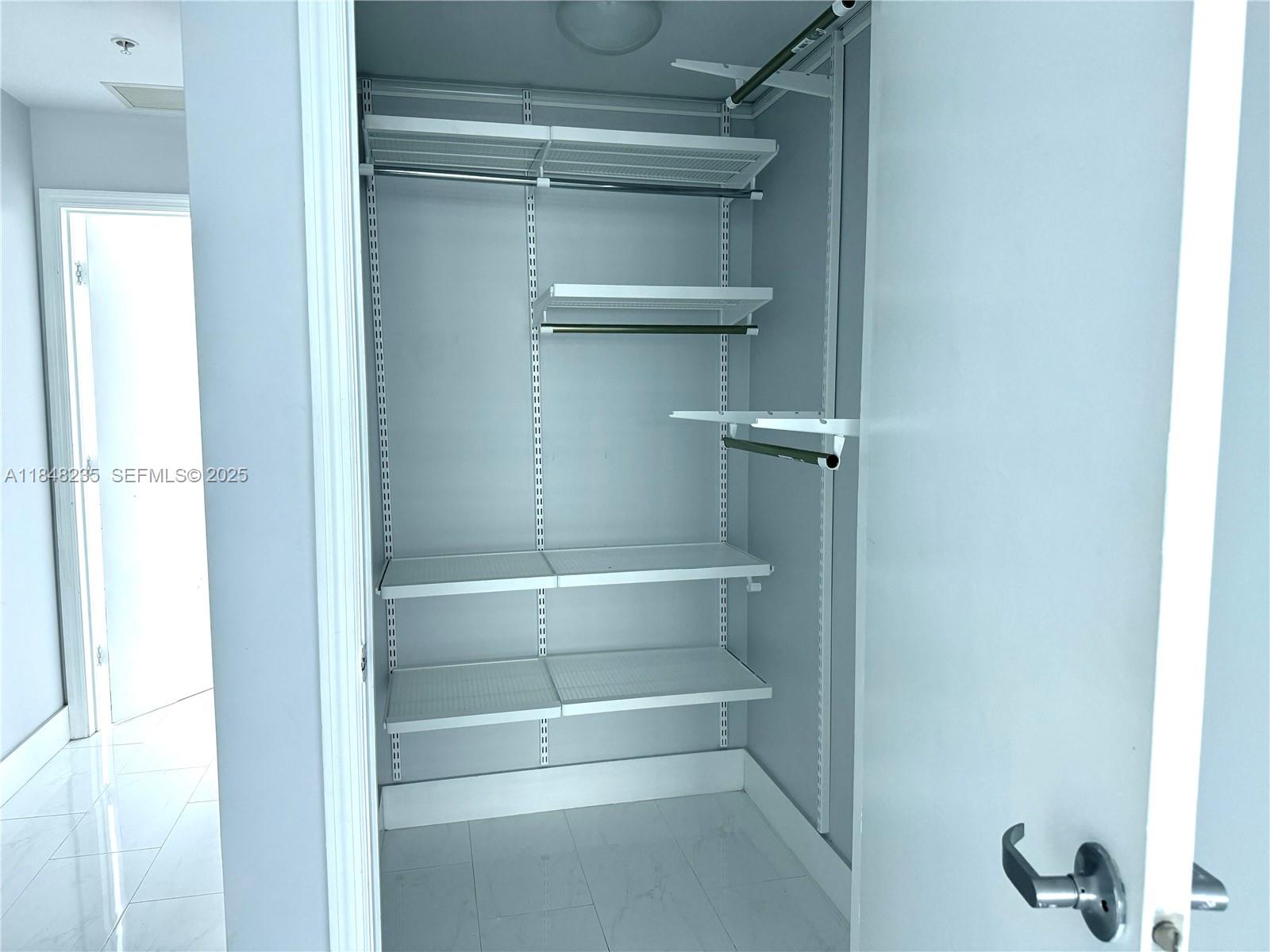 60 Southwest 13th Street, Unit 3408 Miami, FL 33130 - Photo 14 of 27 a view of an empty walk in closet