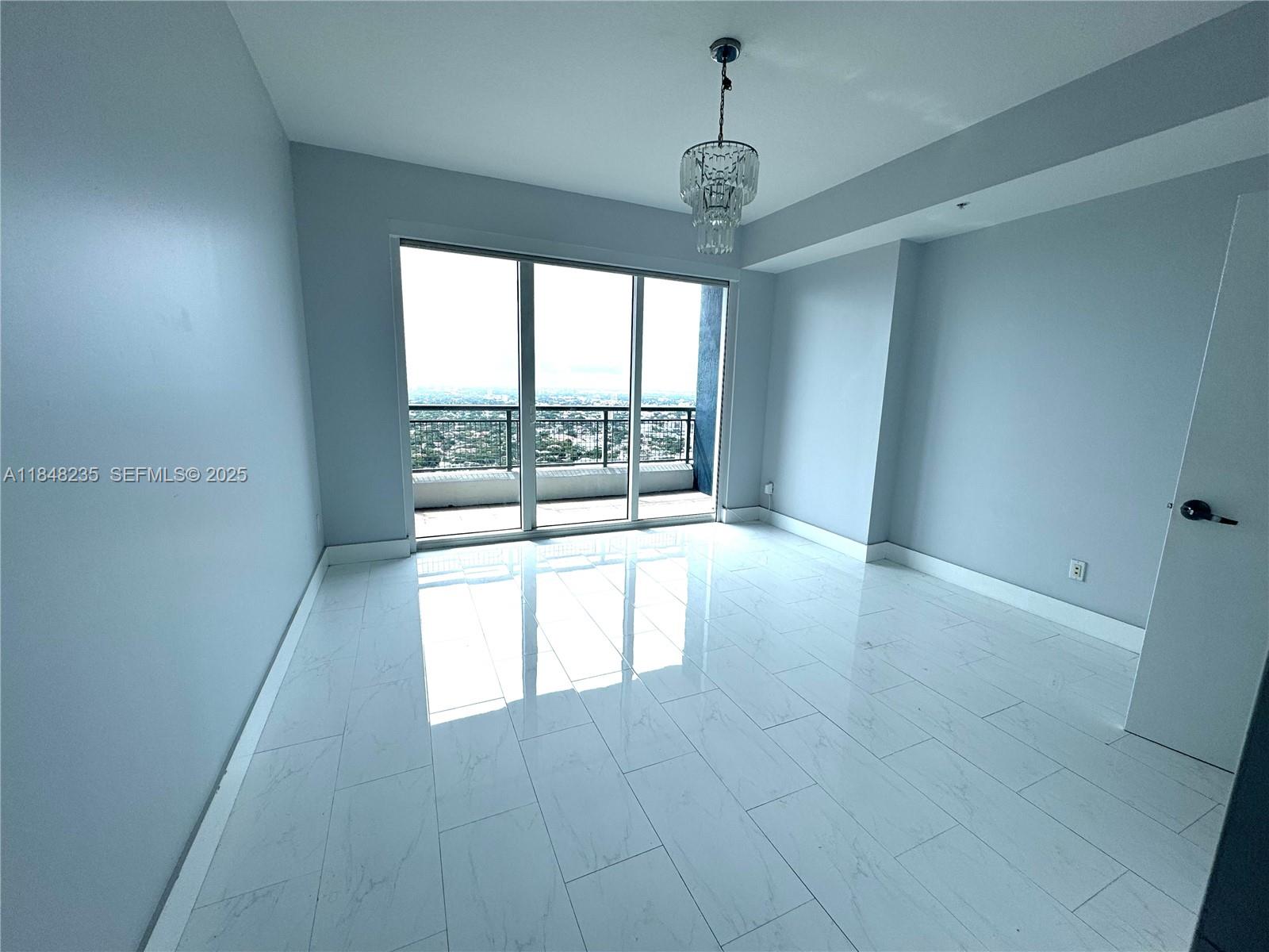 60 Southwest 13th Street, Unit 3408 Miami, FL 33130 - Photo 16 of 27 a view of an empty room with a window