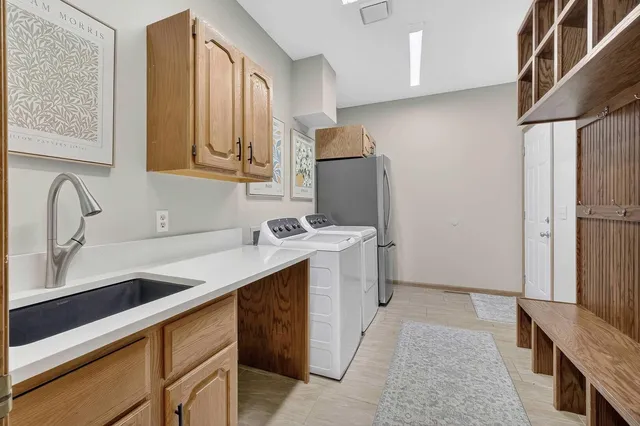 a bathroom with a tub a toilet a mirror and a shower