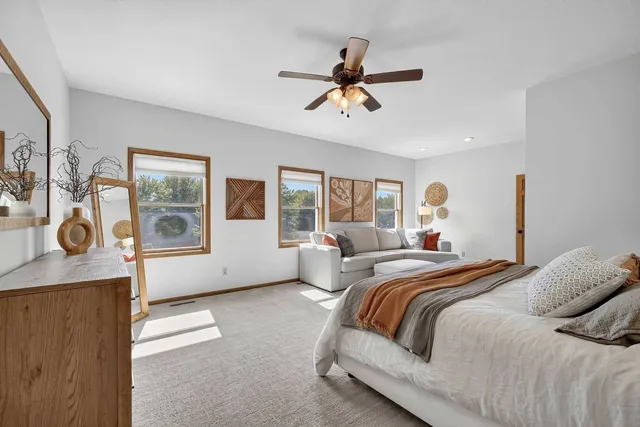 a bedroom with furniture and a window