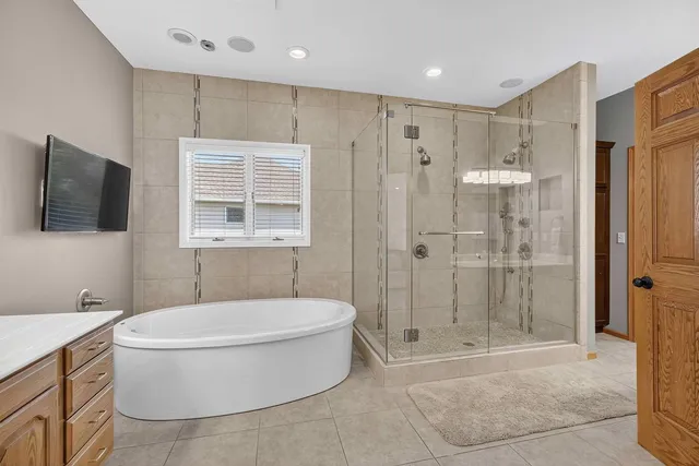 a bathroom with a sink a mirror and a shower