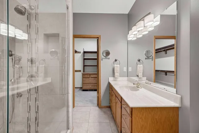 a bathroom with a toilet a sink and shower