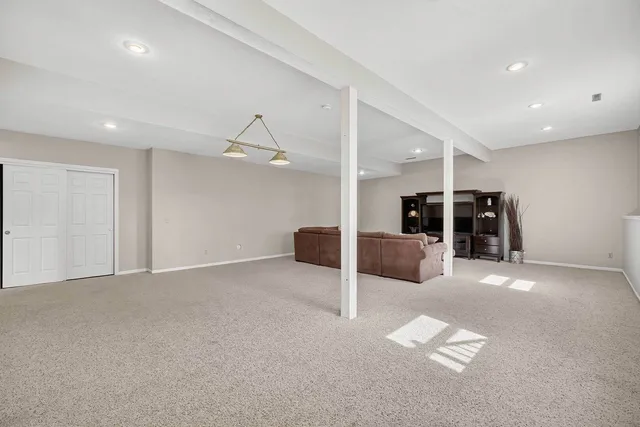 a front view of a house with yard and green space