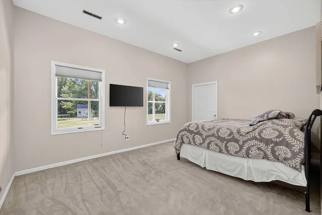 an aerial view of a house with yard swimming pool outdoor seating and yard