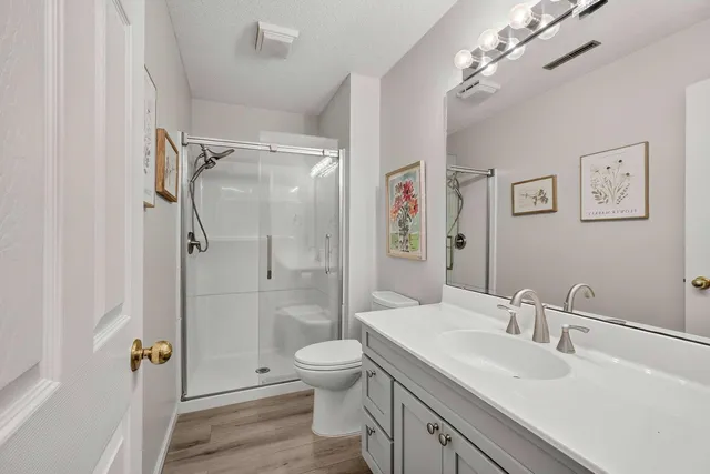 an aerial view of a house with garden space and street view