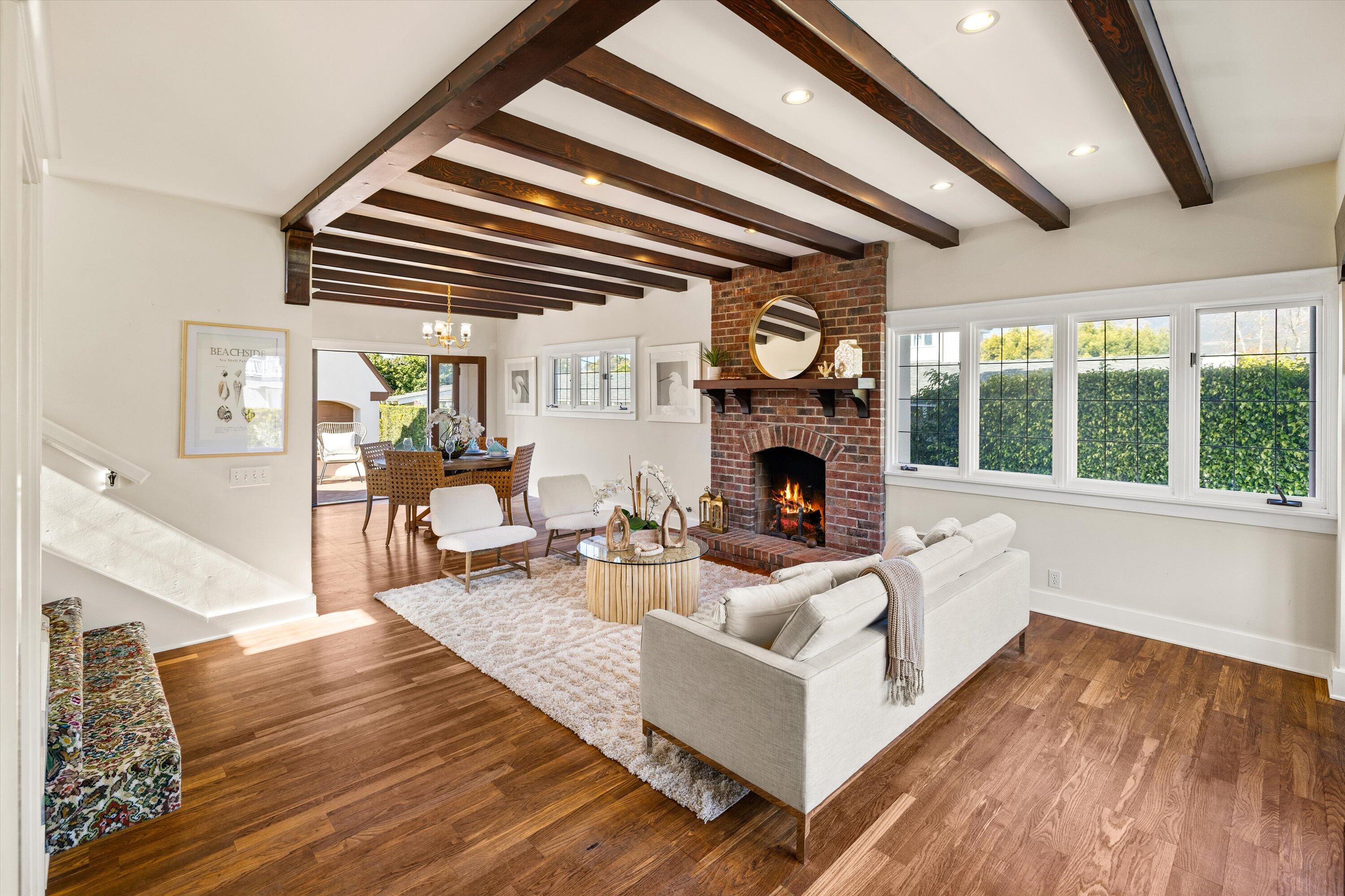 4849 3rd Street Carpinteria, CA 93013 - Photo 11 of 48 a living room with furniture a fireplace and a large window